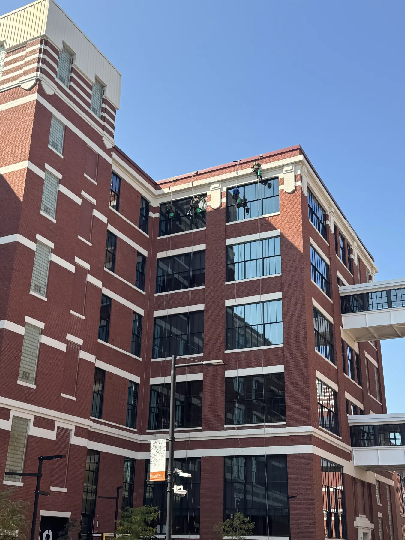 Walden rope access technicians working the upper floors at Do It Best headquarters in Fort Wayne